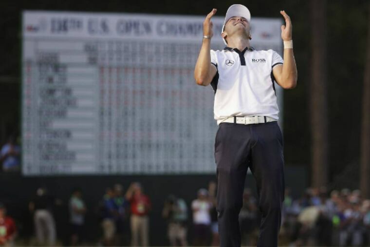 Martin Kaymer, of Germany celebrates after winning the U.S. Open golf tournament in Pinehurst, N.C., Sunday, June 15, 2014. (AP Photo/David Goldman)
