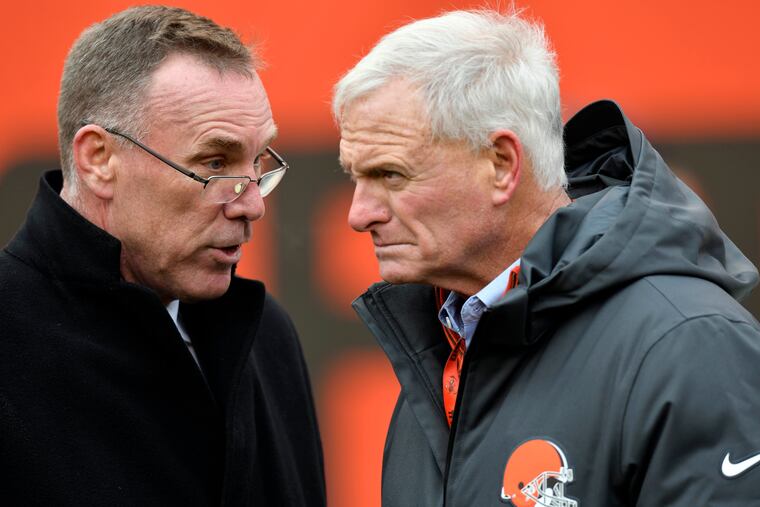 Former Cleveland Browns general manager John Dorsey (left) talks with owner Jimmy Haslam in 2017.
