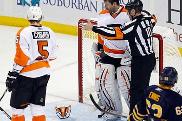"It wasn't intentional," Brian Boucher said of removing his mask at one point during the third period. (Yong Kim/Staff Photographer)