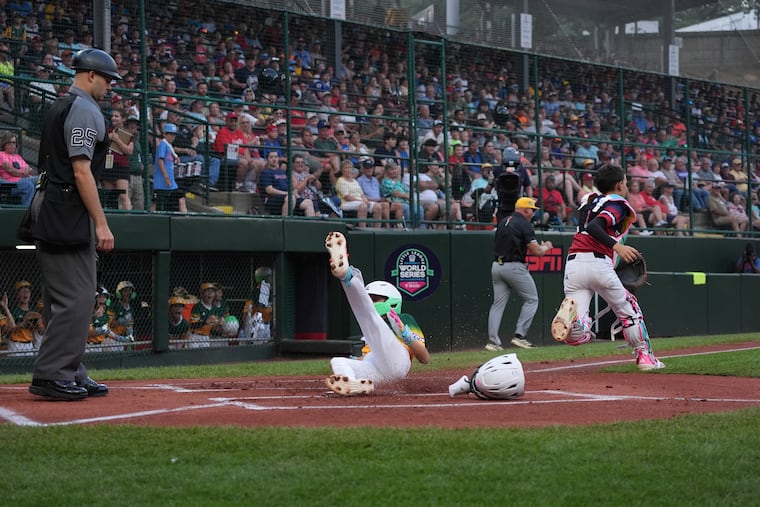 Sioux Falls' Devin Aukes slides home with the first run of the game, in the first inning, against Chester County's Glenmoore Eagle during their Little League World Series game on Thursday.
