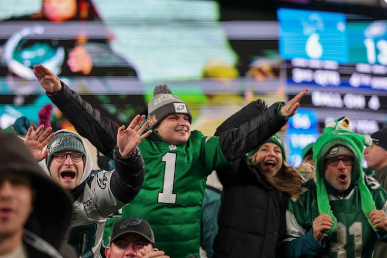 Eagles fans celebrate after the defensive line stops the Detroit Lions on fourth-and-goal in the third quarter Sunday at Lincoln Financial Field.