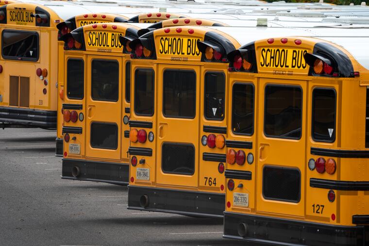 Fairfax County Public School buses are lined up at a maintenance facility in Lorton, Va.