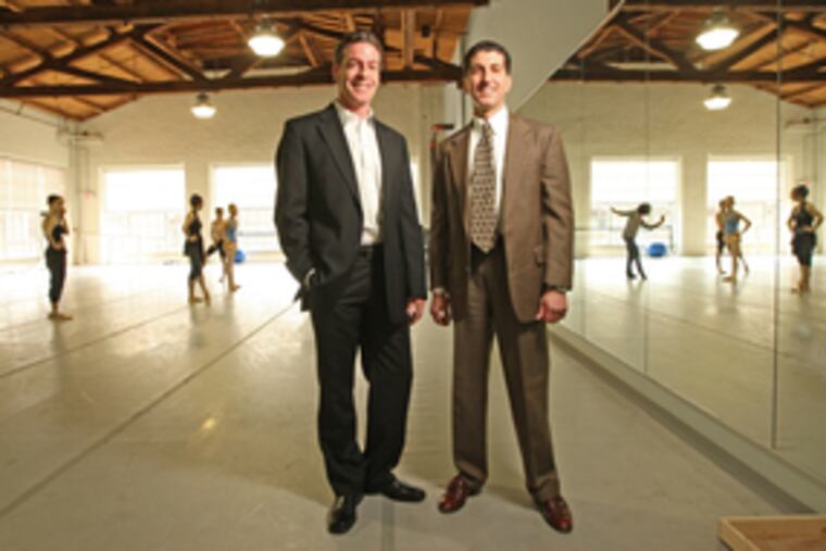 Two leaders of the Pennsylvania Ballet - artistic director Roy Kaiser (left) and executive director Michael G. Scolamiero - visit the company's studios. Their close, enduring cooperation has been praised as an important factor in the ballet's turnaround.