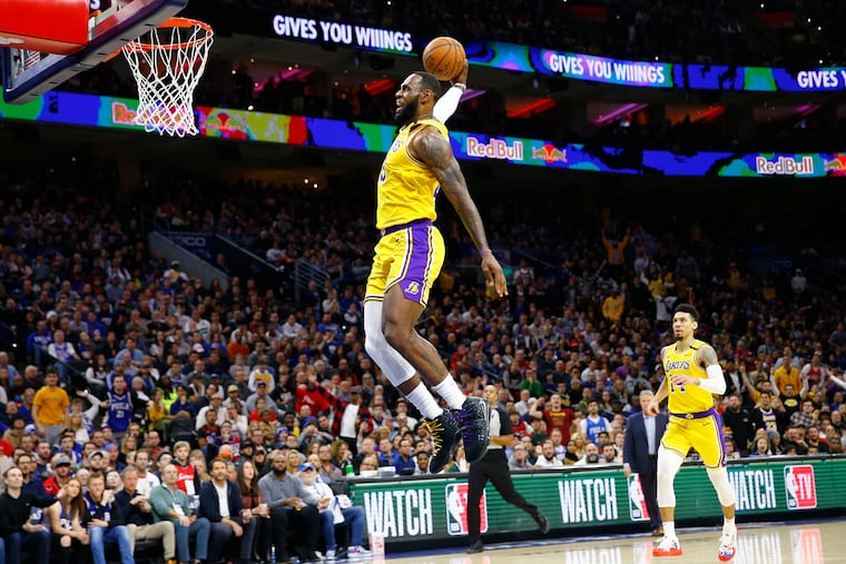 Los Angeles Lakers forward LeBron James dunking the basketball against the Sixers on Jan. 25, 2020.