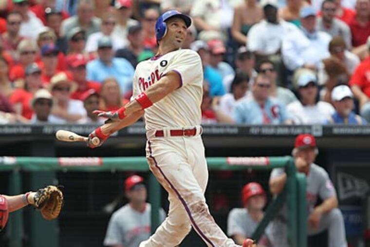 Raul Ibanez hits a three-run home run in the third inning. (David M Warren/Staff Photographer)