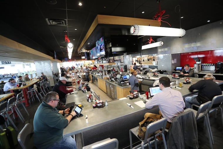 Bar Symon at Philadelphia International Airport. About 50 businesses, including airlines, retailers, car rental companies, and government agencies, are holding a job fair Tuesday at Temple University.