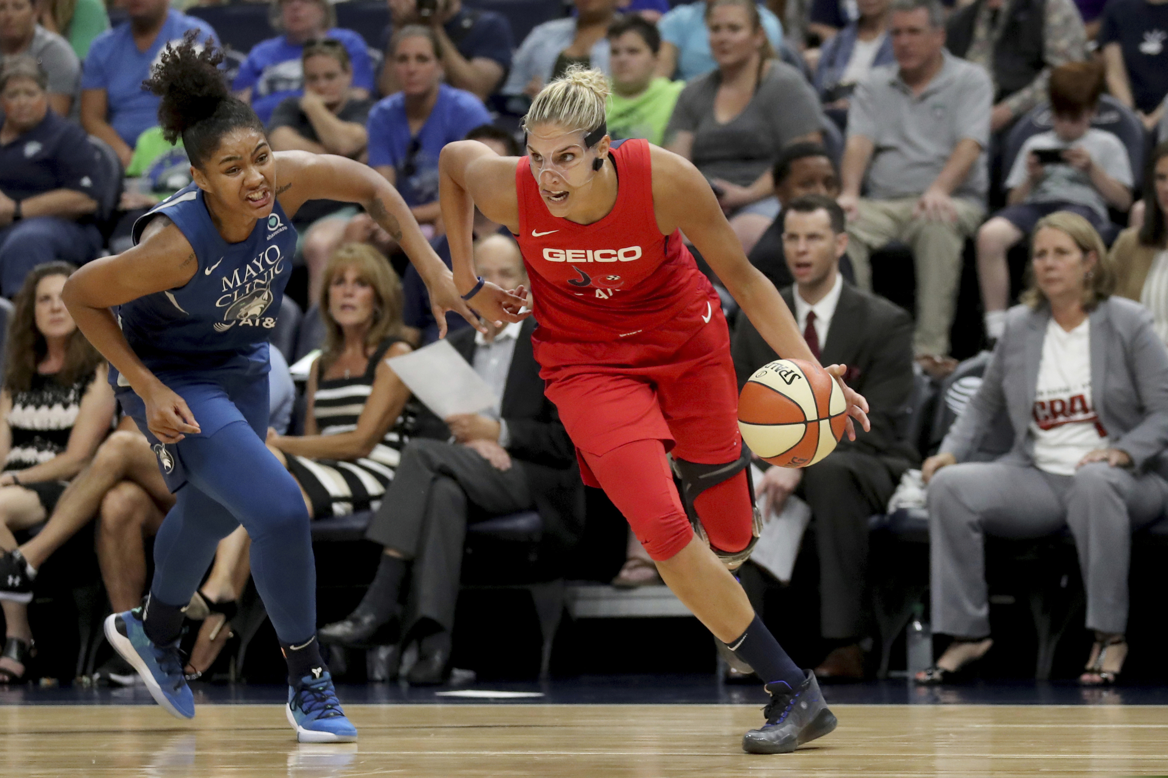 The Washington Mystics' Elena Delle Donne drives against Minnesota Lynx's Damiris Dantas.