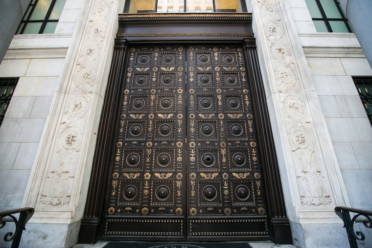 The massive front door to the former Beneficial Bank on Chestnut Street. JESSICA GRIFFIN / Staff Photographer.
