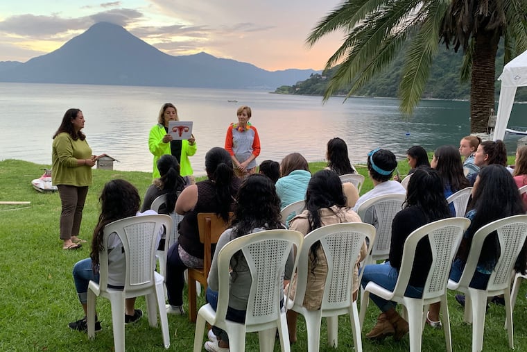 Members of the Project Ensonga Sewing Ministry Maria Leal, Jesse Alejandro and Leslie Roy instruct women and girls in Panajachel, Guatemala.