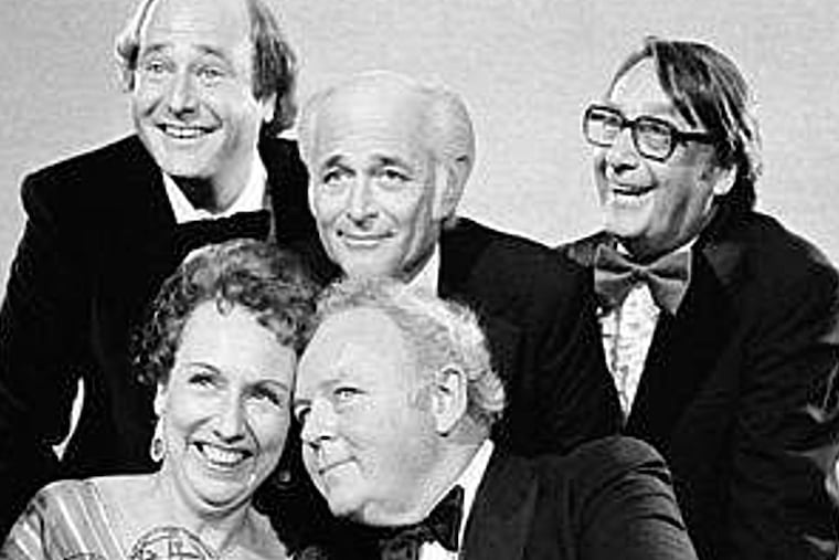 Actors Jean Stapleton, seated, left, and Carroll O'Connor, seated, right, hold their Emmys after receiving them in Los Angeles, Sept. 18, 1978. At rear, from left, Rob Reiner, who won an Emmy for supporting actor in the same series; Norman Lear, producer of the show; and executive producer Mort Lachman.
