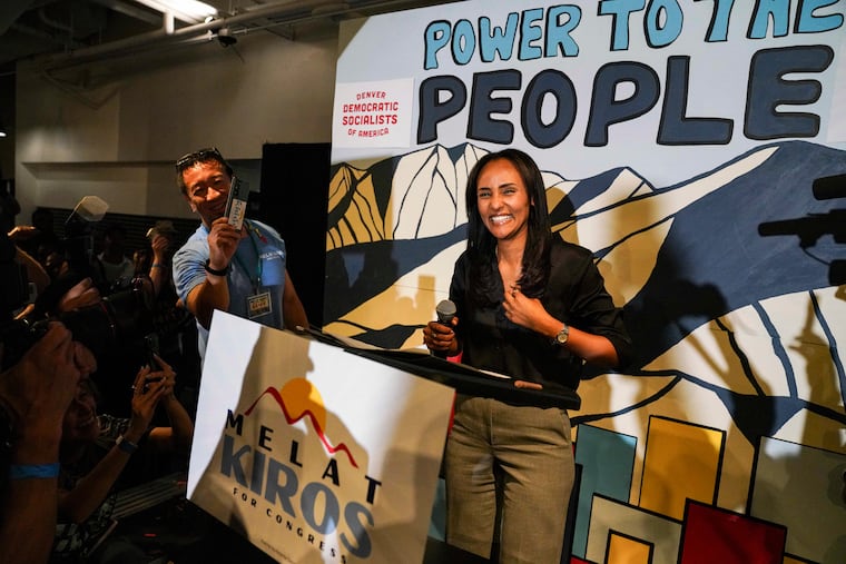 Democratic congressional candidate Melat Kiros, a democratic socialist, stands on stage as supporters cheer after she won the Democratic nomination during a primary election night watch party at The Broadway, Tuesday, June 30, 2026, in Denver.