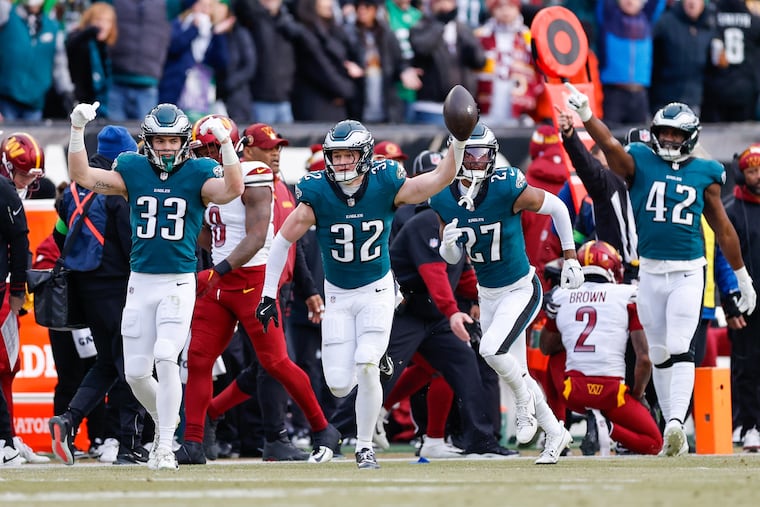Eagles safety Reed Blankenship (center) celebrates a fumble recovery on Sunday. The Eagles pride themselves on attacking the football defensively.