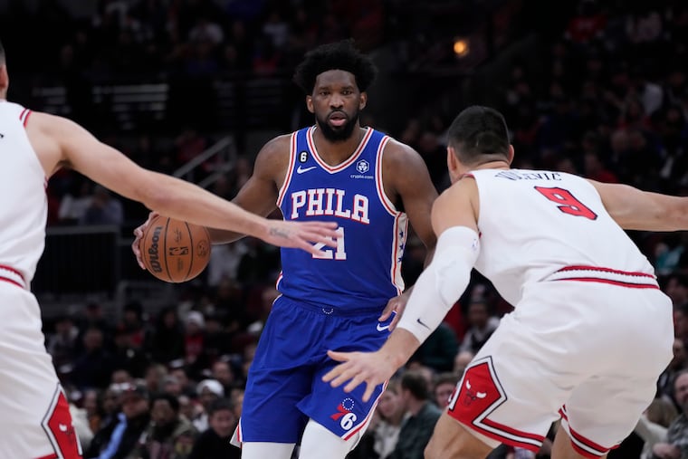 The Sixers' Joel Embiid brings the ball up during the first half of an NBA basketball game against the Chicago Bulls Wednesday, March 22, 2023, in Chicago. (AP Photo/Charles Rex Arbogast)