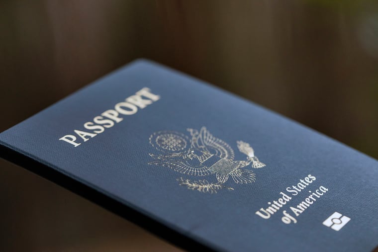 The cover of a U.S. Passport is displayed in Tigard, Ore., Dec. 11, 2021. Americans can now renew their passports online, bypassing a cumbersome mail-in paper application process that often causes delays. The State Department announced its online passport renewal system is now fully operational.