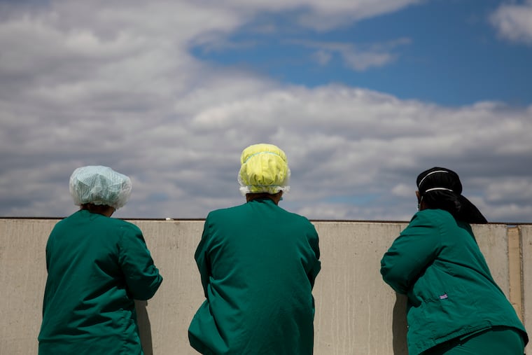 Medical workers watched on May 12 as KC-135R Stratotanker from the 108th Wing and three F-16 Fighting Falcons from the 177th Fighter Wing flew over Jefferson Cherry Hill Hospital in honor for the men and women working on the frontlines during the coronavirus pandemic.