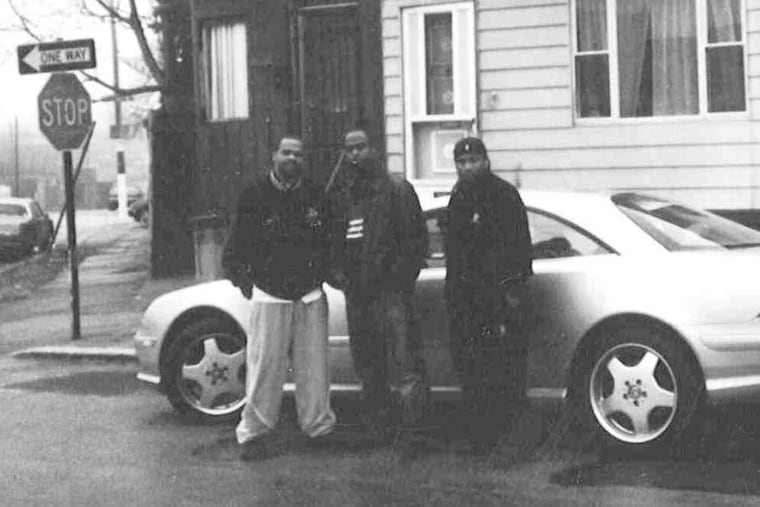A federal-trial evidence photo from 2007 shows Kaboni Savage (left) with Eugene Coleman (right). Lamont Lewis was known to police as an associate of Savage, a drug kingpin. Lewis' cousin helped the FBI carry out its sting operation.