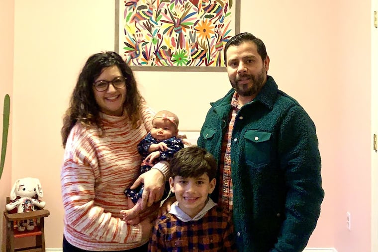 Liz and Christhian with newborn Emilia and son, David.