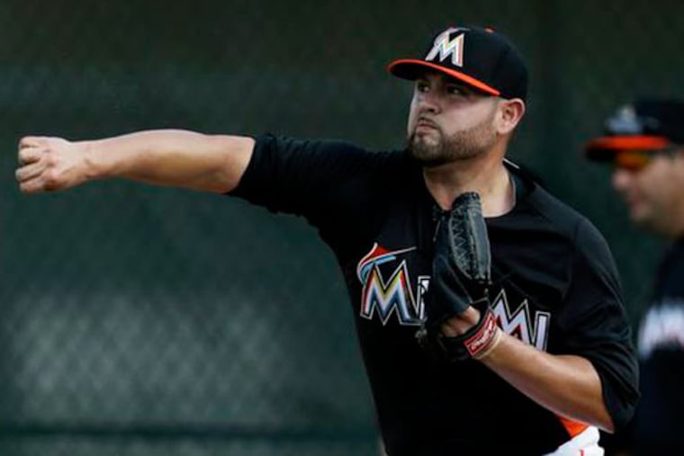 Miami Marlins starting pitcher Ricky Nolasco throws a bullpen session during spring training baseball in Jupiter, Fla. Nolasco has won at least 10 games for the Marlins six times and is their career leader in victories. And now, by default, he's their ace. (Julio Cortez/AP)