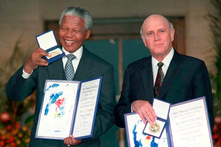 South African Deputy President F.W. de Klerk (right) and South African President Nelson Mandela posed with their Nobel Peace Prize Gold Medal and Diploma, in Oslo on Dec. 10, 1993.
