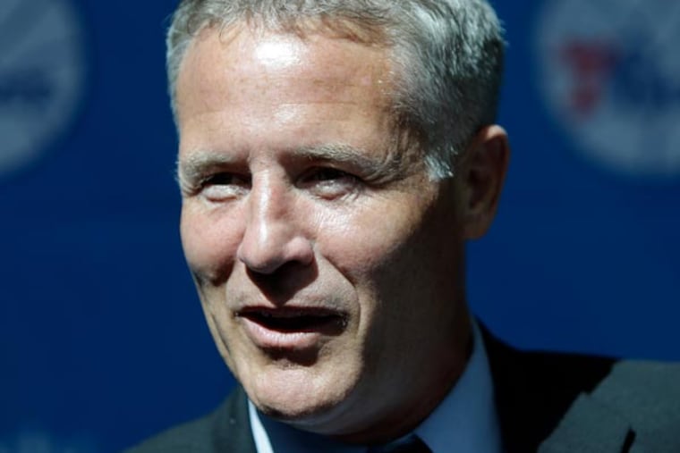 76ers incoming head coach Brett Brown smiles at the end of a news conference, Wednesday, Aug. 14, 2013, in Philadelphia. Brown's hire ended a four-month search to replace Doug Collins. (Matt Rourke/AP)