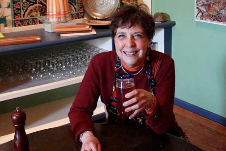 Chef Aliza Green at a table at Baba Olga's Cafe, inside the Material Culture store in Philadelphia. MICHAEL KLEIN / Philly.com