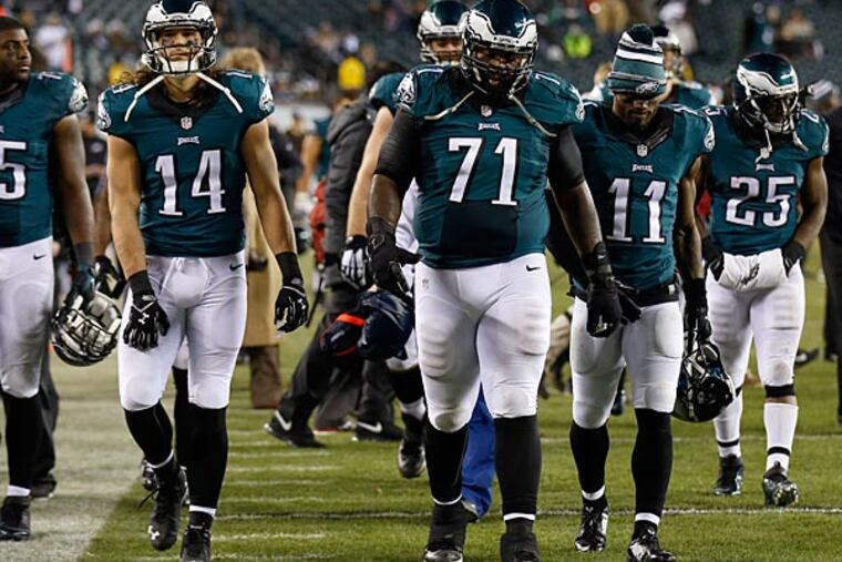 Eagles' Vinny Curry, Riley Cooper, Jason Peters, Josh Huff and LeSean
McCoy walk off the field after losing to the Dallas Cowboys. (Yong Kim/Staff Photographer)