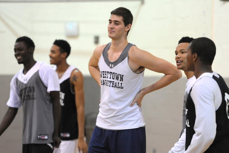 Westtown School's junior center, Georgios "George" Papagiannis (center), who stands 7' 1" tall, and his first-team teammates catch their breaths during practice Nov. 21, 2013. ( CLEM MURRAY / Staff Photographer )