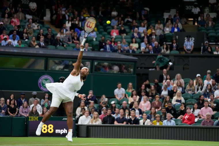 Serena Williams of the US serves to Aliaksandra Sasnovich of Belarus for the women's singles first round match on day two of the Wimbledon Tennis Championships in London.