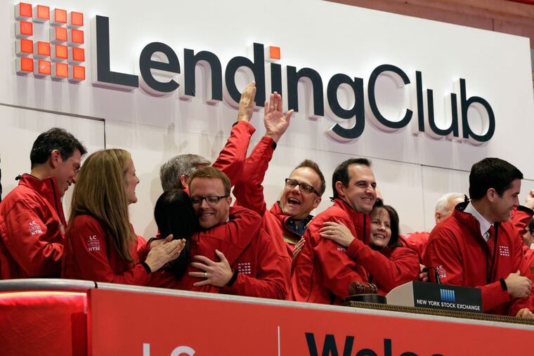 Renaud Laplanche, third from right, founder & CEO of Lending Club, embraces company CFO Carrie Dolan during opening bell ceremonies of the New York Stock Exchange, to mark Lending Club's IPO in 2014.