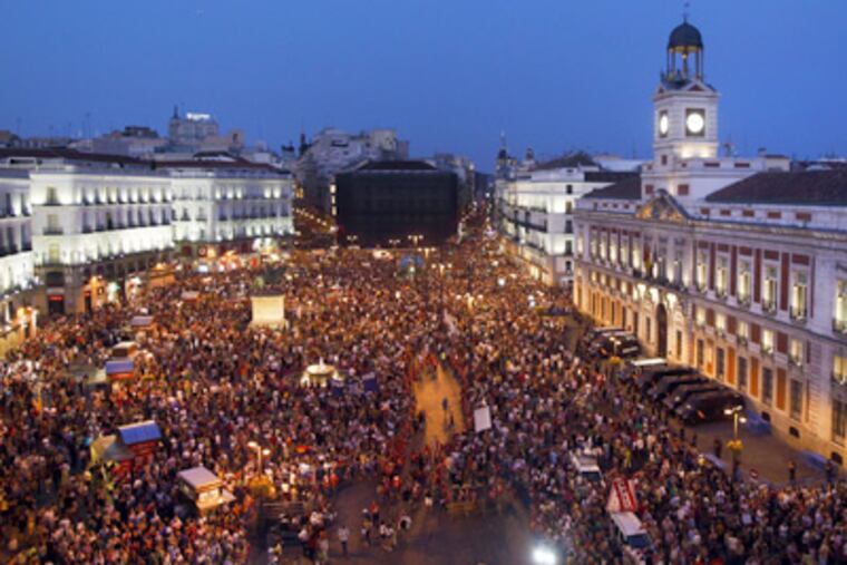 Demonstrators in Madrid, Spain, protesting austerity measures announced last week in an attempt to cut its bloated deficit. (Andres Kudacki/AP Photo)