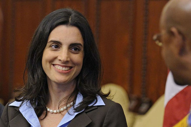 FILE PHOTO: Rebecca Rhynhart smiles as then-Mayor Nutter formally announces her appointment as city budget director.