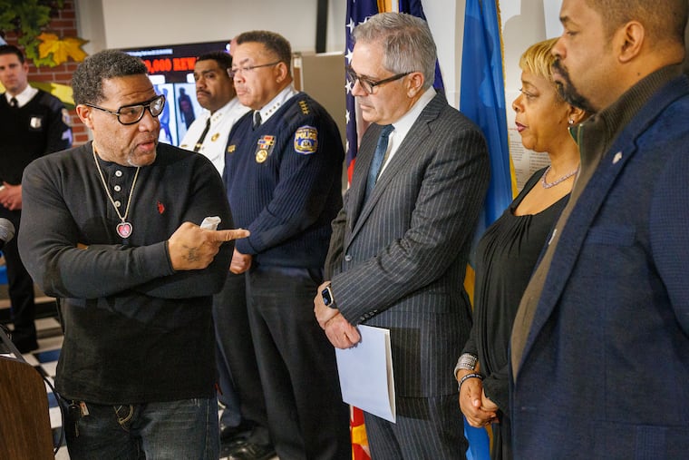 Gary Weedon, father of Devin, turns to Philadelphia District Attorney Larry Krasner and Councilmember Cindy Bass to at a news conference about an arrest in his son's homicide.