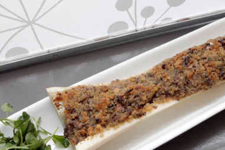 Chunks of veal marrow, garlicky breadcrumbs, and woodsy chanterelles, left, are primally good, served in a long bone cut in half. The escargot appetizer brings tender snails in Bordelaise gravy, with green favas and wild mushrooms.