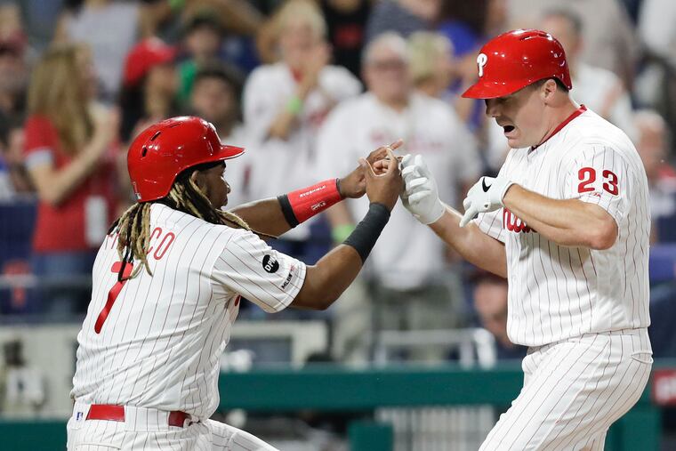 The Phillies' Jay Bruce celebrates with teammate Maikel Franco after hitting a sixth-inning, two-run home run in Monday's 13-7 win over the Mets.