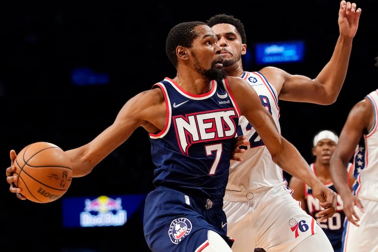 Brooklyn Nets forward Kevin Durant (7) drives to the basket against Sixers forward Tobias Harris (12) during the second half of an NBA basketball game, Thursday, Dec. 16, 2021, in New York. The Nets won 114-105.