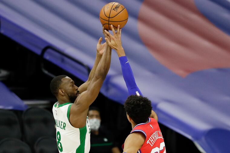 Sixers guard Matisse Thybulle blocks Boston Celtics guard Kemba Walker's third quarter three point attempt on Friday, January 22, 2021 in Philadelphia.