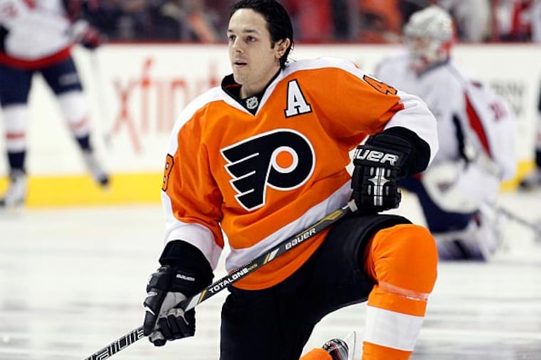 Flyers' Danny Briere kneels on the ice during pre-game warm-ups before
the Flyers played the Washington Capitals on Wednesday, February 27, 2013. (Yong Kim/Staff Photographer)