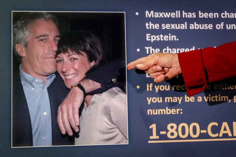 Audrey Strauss, acting U.S. attorney for the Southern District of New York, points to a photo of Jeffrey Epstein and Ghislaine Maxwell during a news conference in 2020.