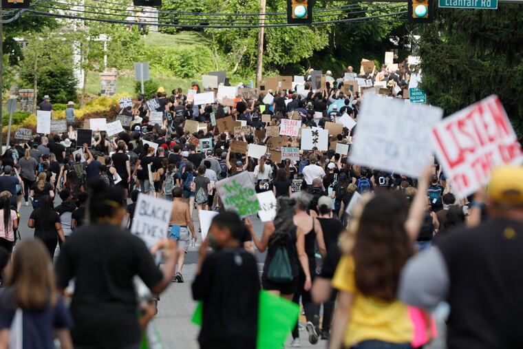 Black Lives Matter protesters march on Montgomery Avenue to Lower Merion High School in Ardmore, Pa., on June 7, 2020.