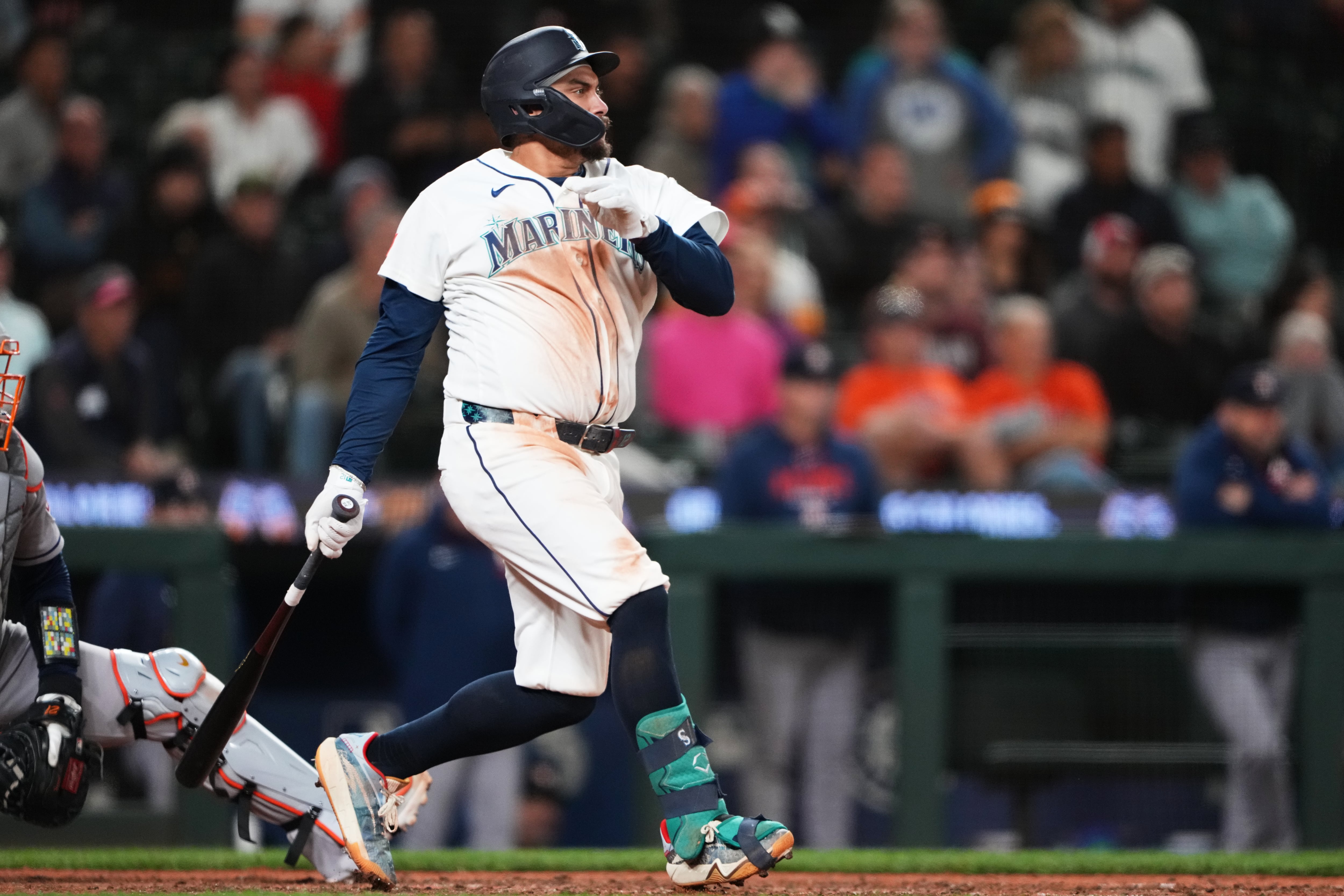 Mariners rally past Astros 6-5 in 10 innings to keep faint playoff hopes alive