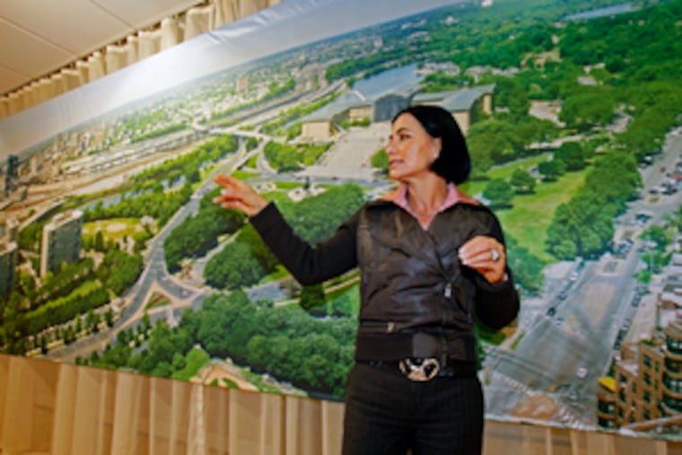 Developer Dalia Shuster with an image simulating views from the Parkway22 condominium tower. Though 12 stories shorter than originally proposed, it is being built with community acceptance instead of time-consuming litigation.