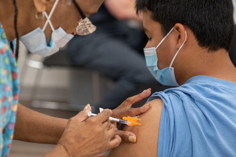 Connor Victoria, 15, was inoculated with the COVID-19 vaccine at Delaware County Wellness Center in Yeadon in August.