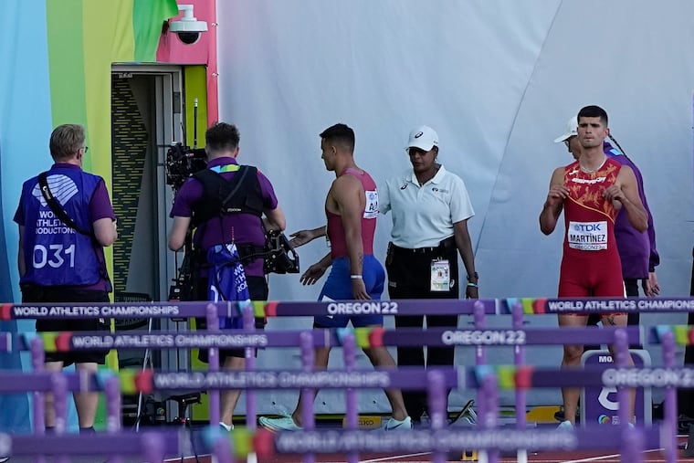 Devon Allen, of the United States, leaves the track after getting disqualified in the 110 mens hurdles final at the World Athletics Championships on Sunday, July 17, 2022, in Eugene, Ore. (AP Photo/David J. Phillip)