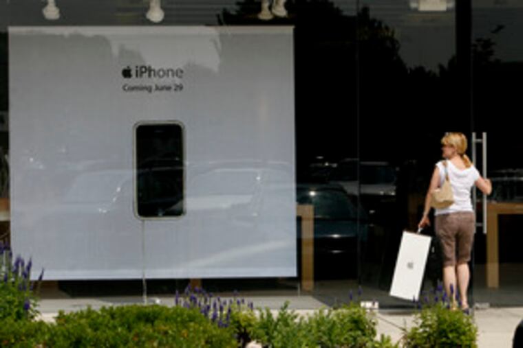 Suzi Massey of Marlton enters the Apple store in Marlton, where a display announces the new iPhone. Its all-in-one nature is part of its appeal. It combines a cell phone, iPod music player, and camera, and it has a touch screen.