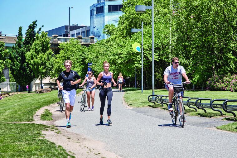 Runners and cyclist using the Schuylkill River Trail on Friday, June 10, 2016.