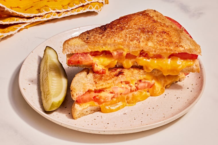 Parmesan-crusted grilled cheese with tomato. MUST CREDIT: Justin Tsucalas/For the Washington Post