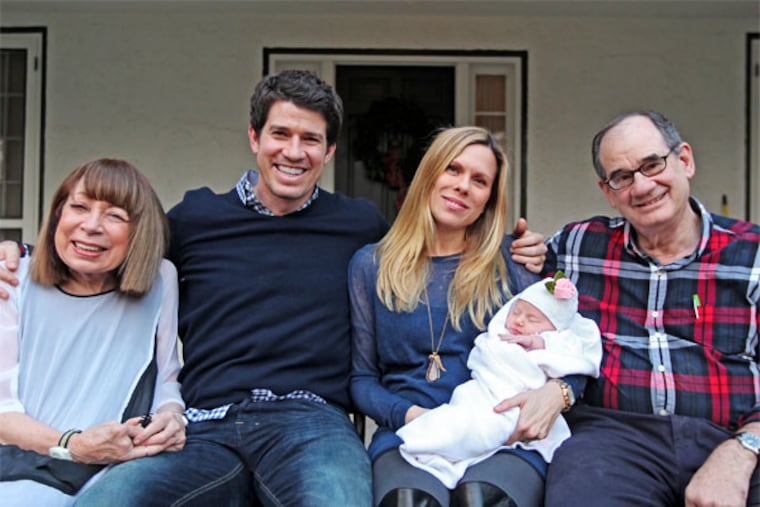 The happy Hollingers: (from left) grandmother Meg, father and mother Jake and Beth, baby Elason Rose, and grandfather Chip. MICHAEL BRYANT / Staff Photographer