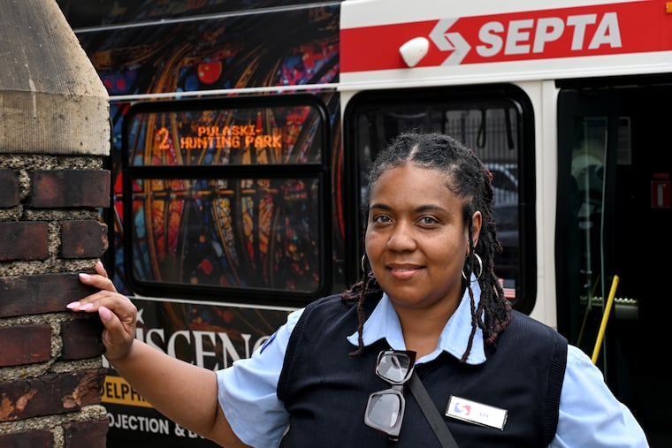 Keya Sampson, a SEPTA bus operator, says a plan to use 60-foot articulated buses on Route 4 in the New Bus Network could compromise safety on narrow streets in North Philadelphia. She's shown at the transit authority's Southern Division bus depot Thursday.