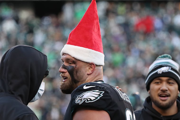 Eagles offensive tackle Lane Johnson wears a Christmas hat after he scored a touchdown in the fourth quarter.