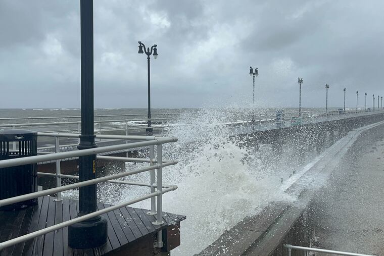 Surf pounds the Boardwalk at Maine Avenue in Atlantic City during a nor'easter Monday.